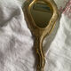 Patinated wooden Florentine hand mirror