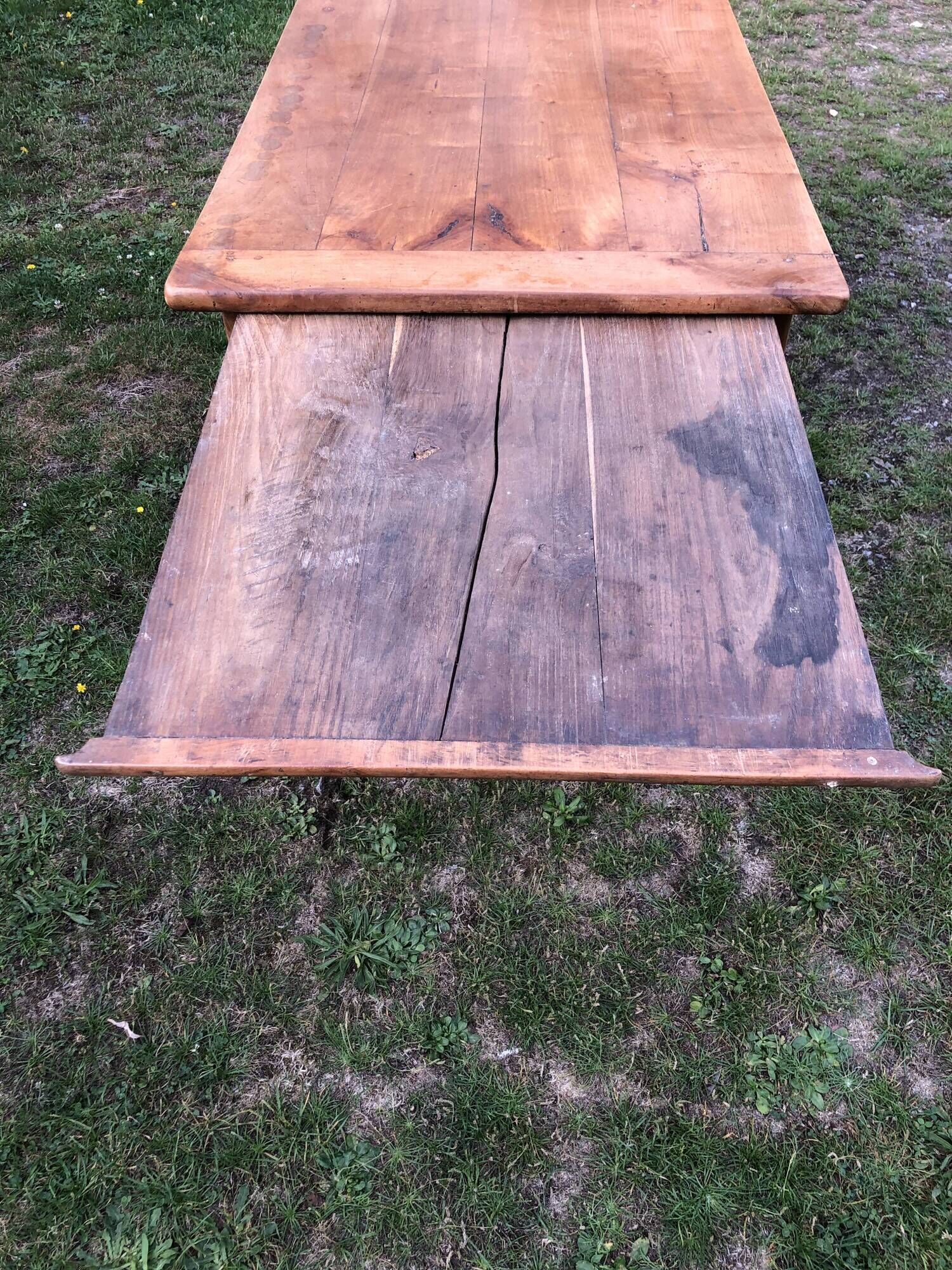Antique farmhouse table in solid cherry wood with 2 drawers and 1 pull-out at the end with turned legs.