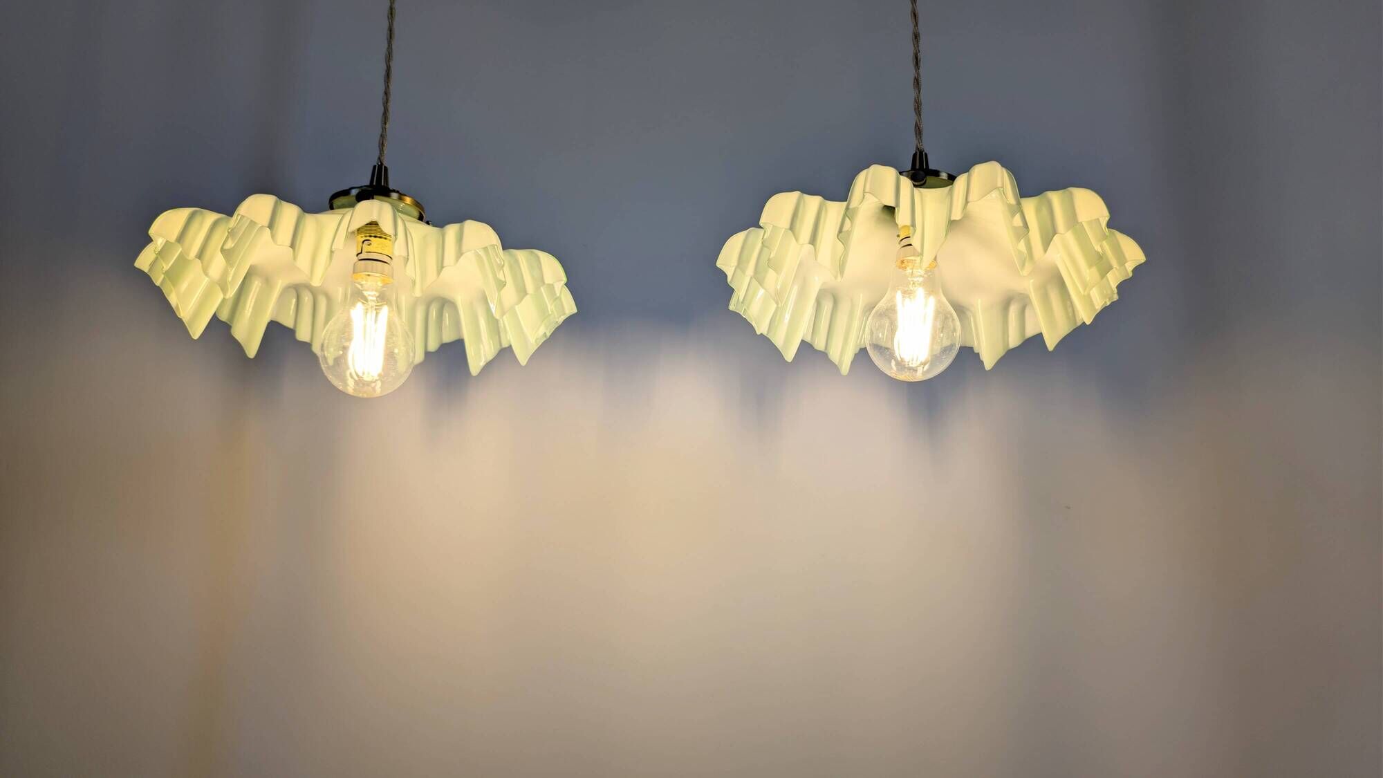 Pair of green opaline glass pendant lights – frosted poetry & Art Deco brilliance