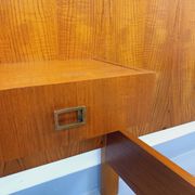 Double bed vintage modernist in teak and black metal from the 1960s with bedside tables.