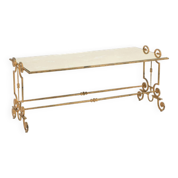 Table basse en fer forgé doré et plateau de verre églomisé. Années 1970