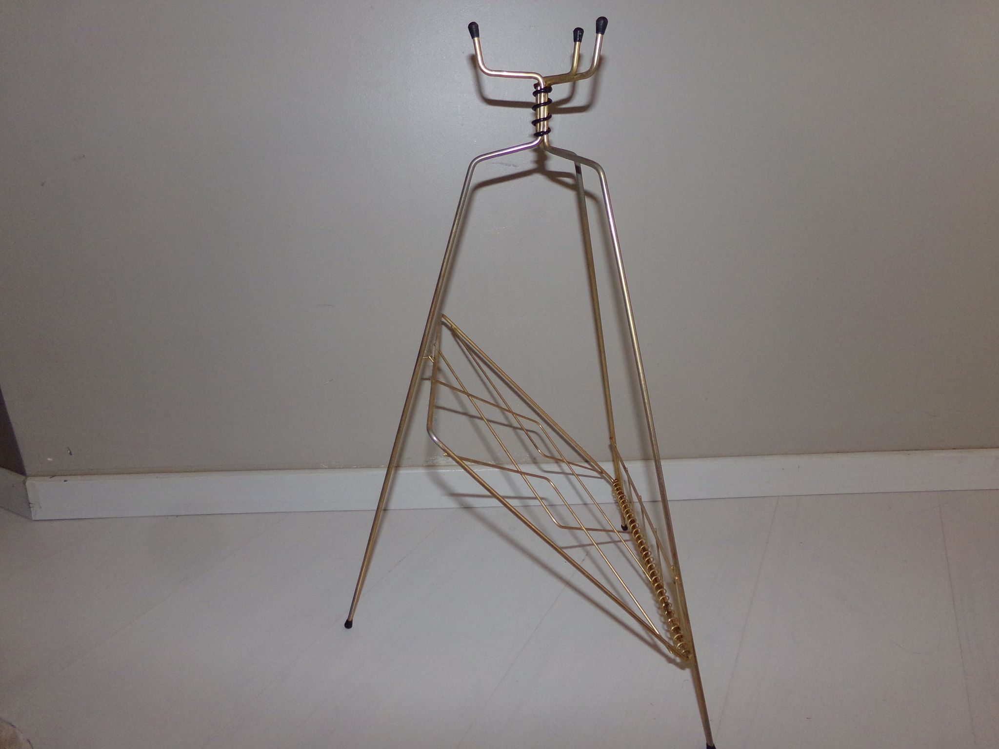 Vintage magazine holder in gold metal