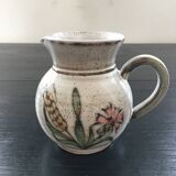 Signed pitcher with thistle decoration