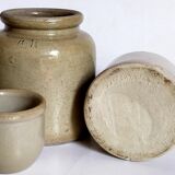Set of three pots with old condiments in glazed earth