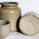 Set of three pots with old condiments in glazed earth