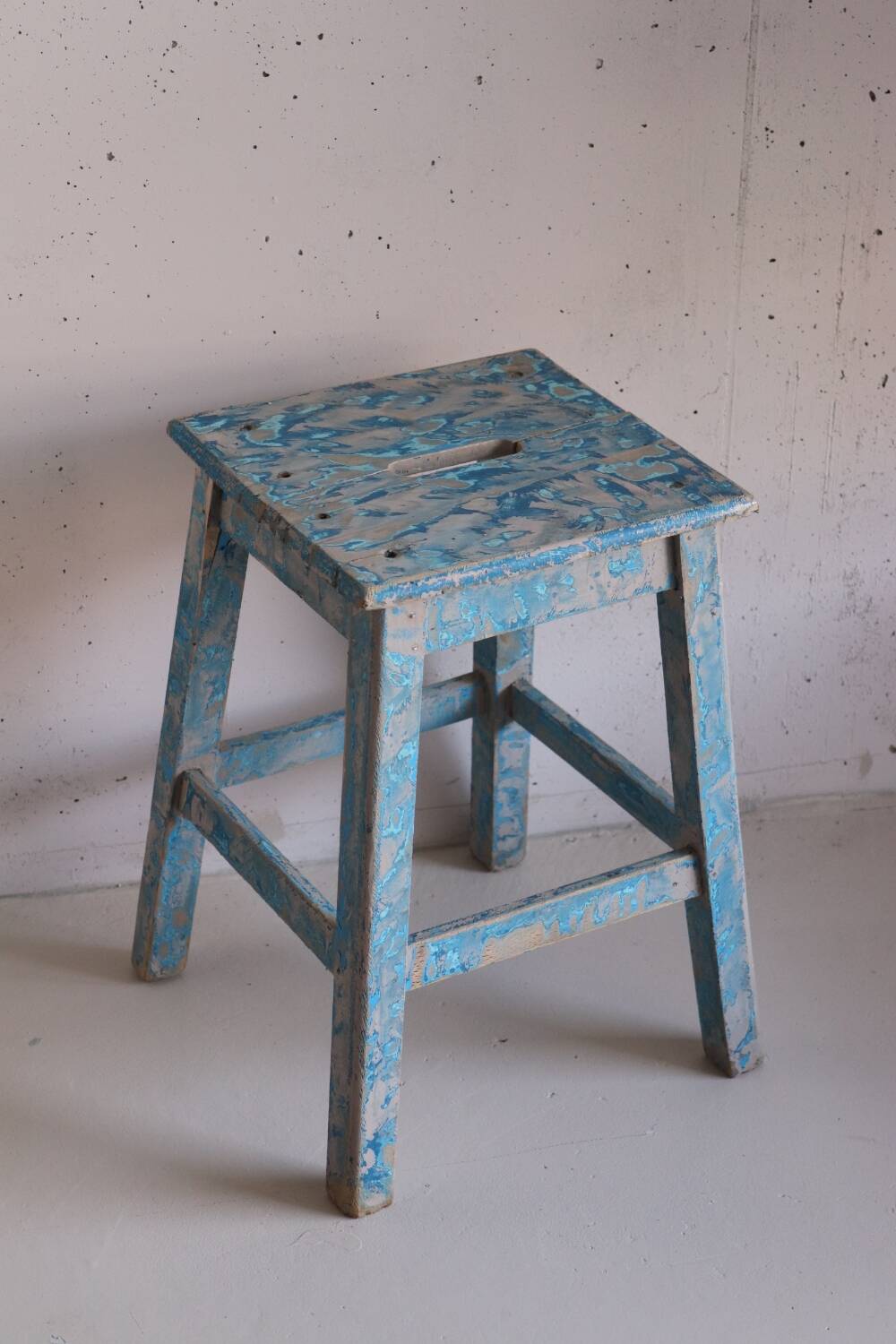 Blue patinated farm stool