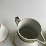 Series of 4 small pitchers.