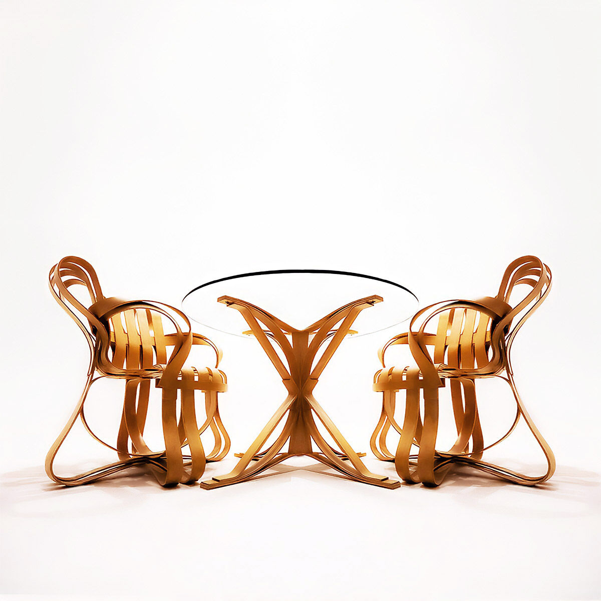 Frank Gehry dinette with 2 bentwood Cross Check chairs and a Face Off dining table for Knoll Inc.