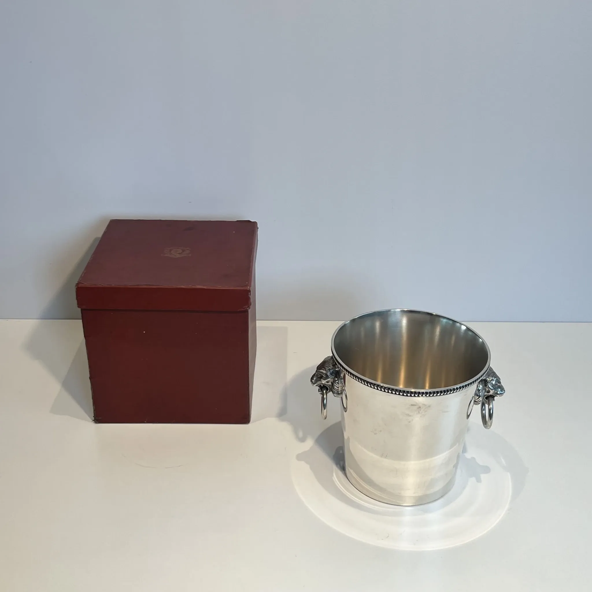 Silver-plated champagne bucket Orfèvrerie Saint-Médard. Handles in the shape of heads.