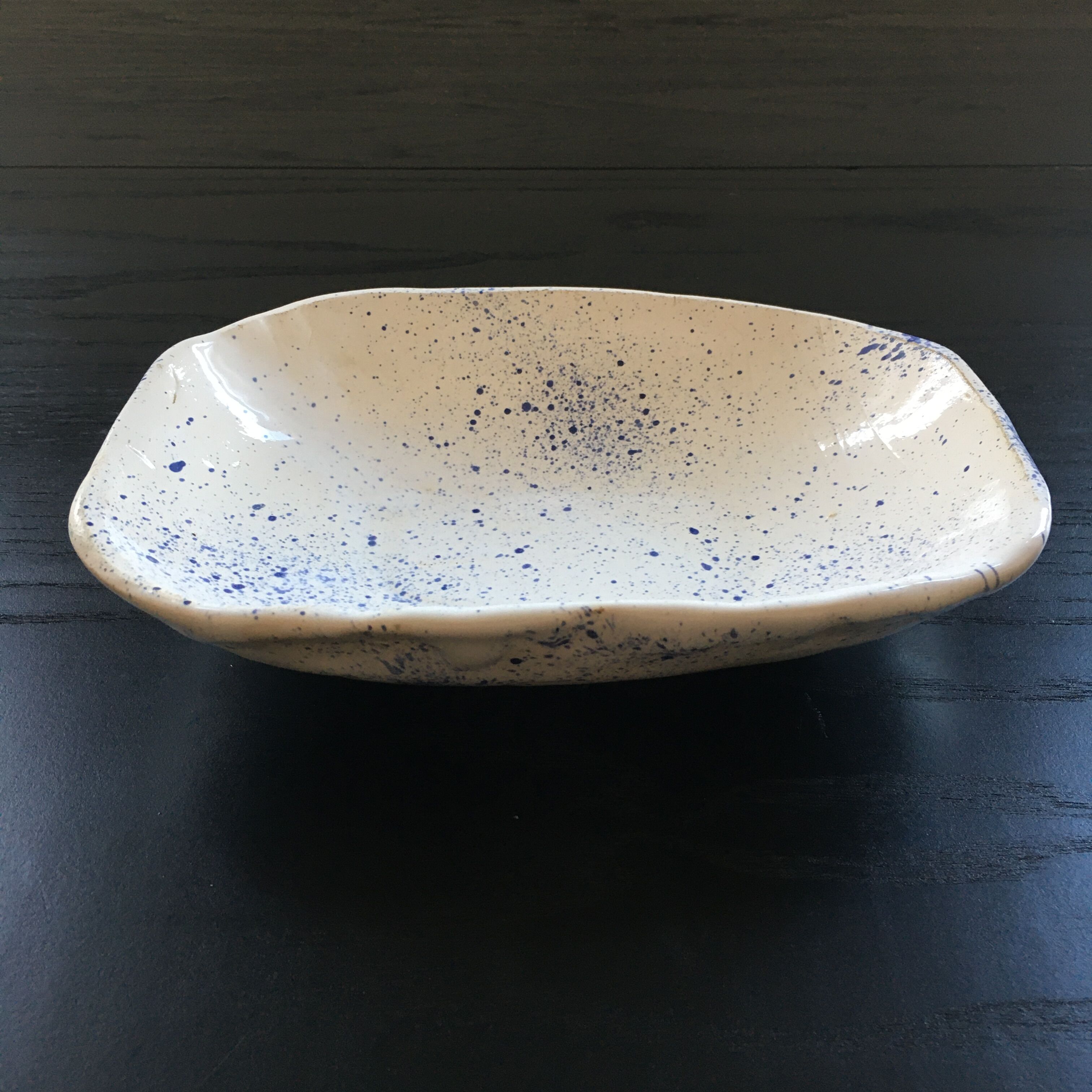 Empty blue speckled white pocket