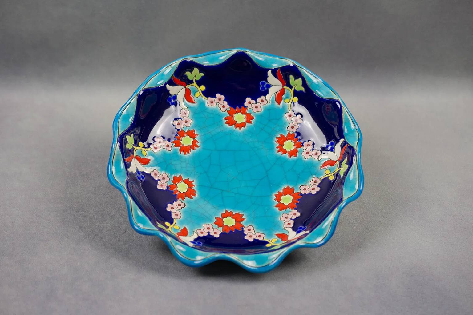 Longwy coupe model Roxane – Floral enamels on a crackled turquoise background