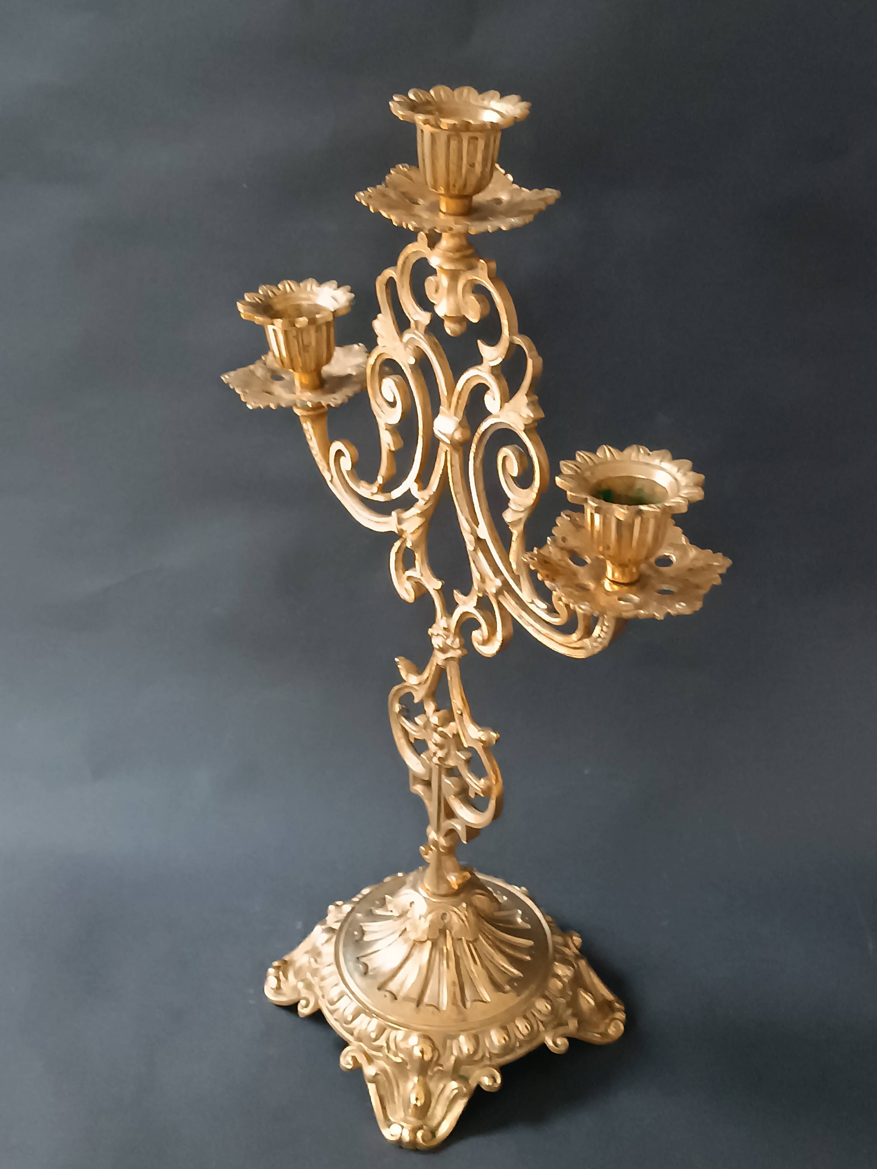 Antique three-light openwork brass church candelabrum.