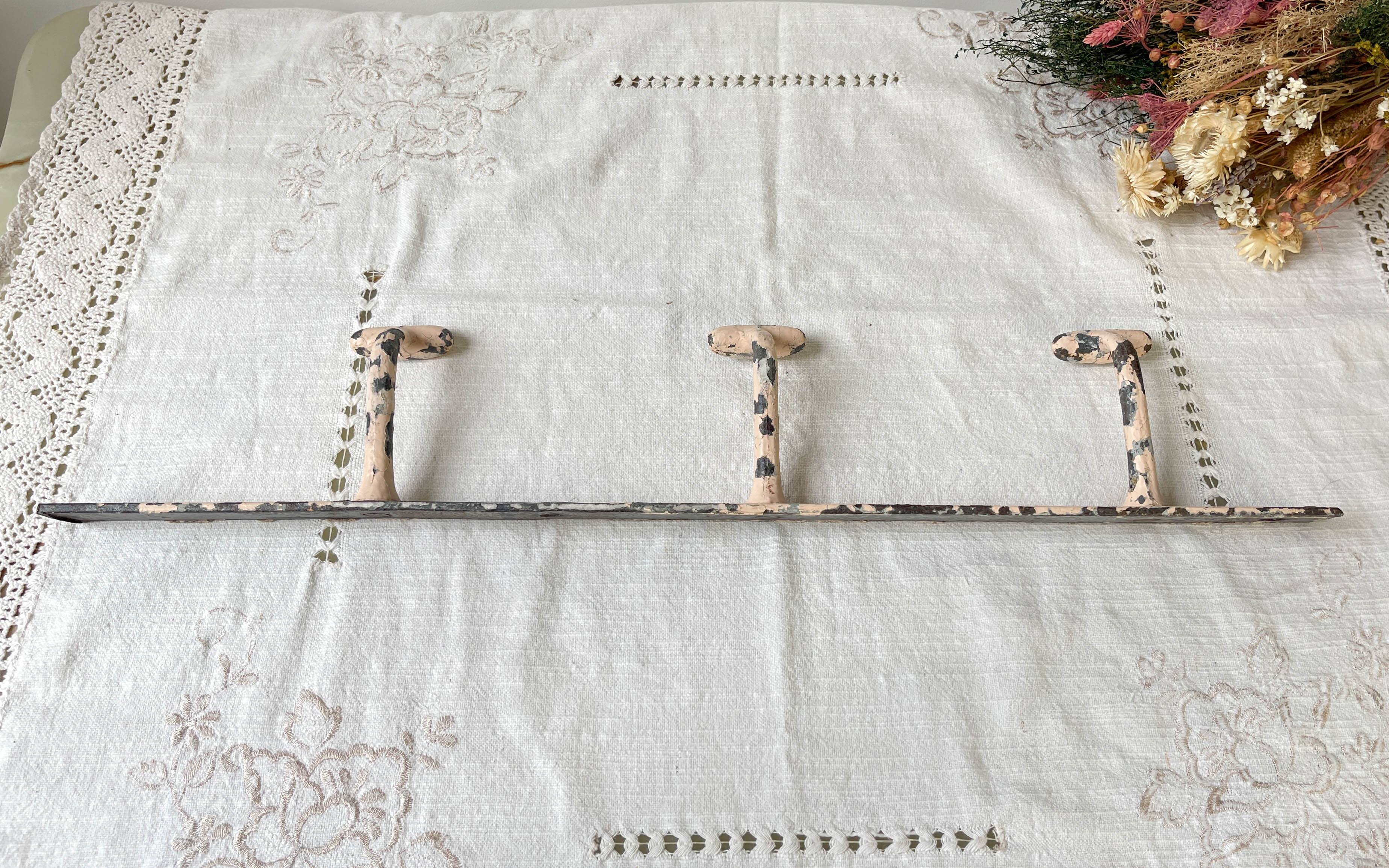 Vintage enameled cast iron wall hook with 3 hooks