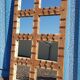 Old Burmese teak mirror with copper fittings