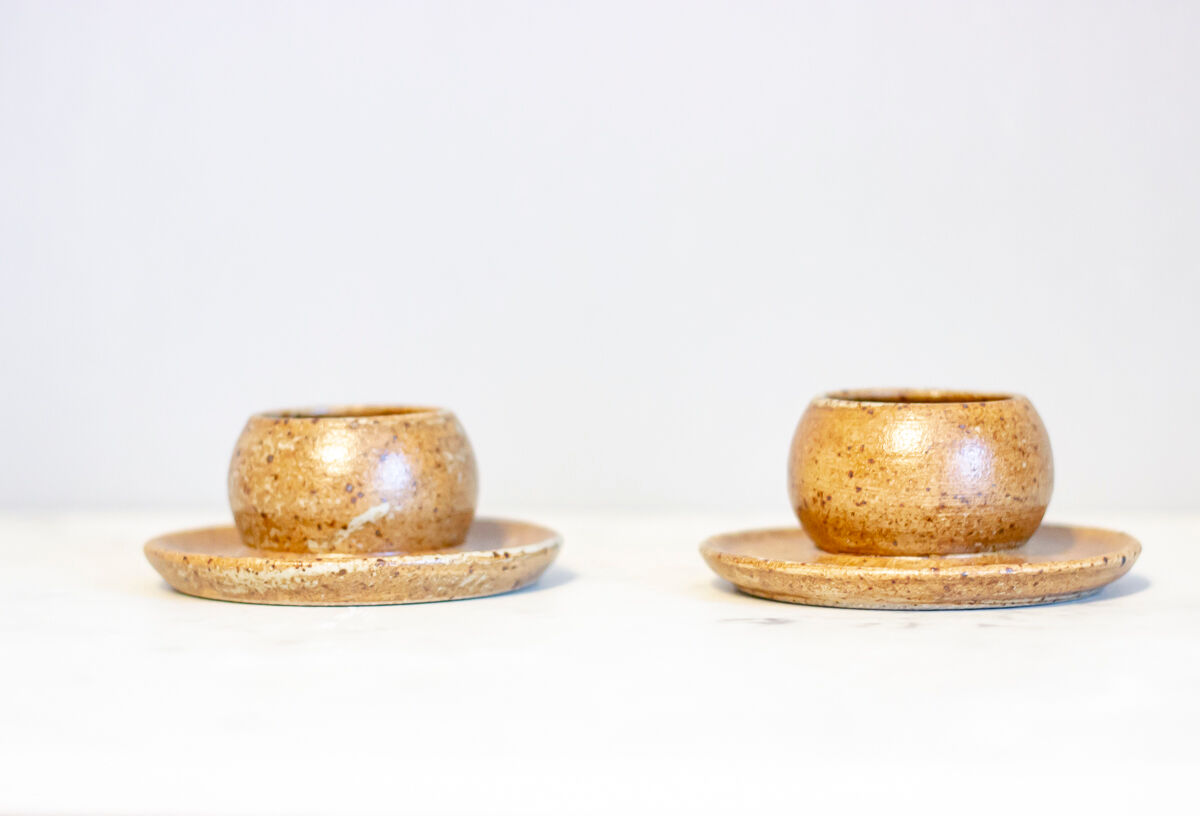 2 stoneware shells, unidentified signature