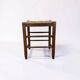 Tabouret vintage avec assise en paille