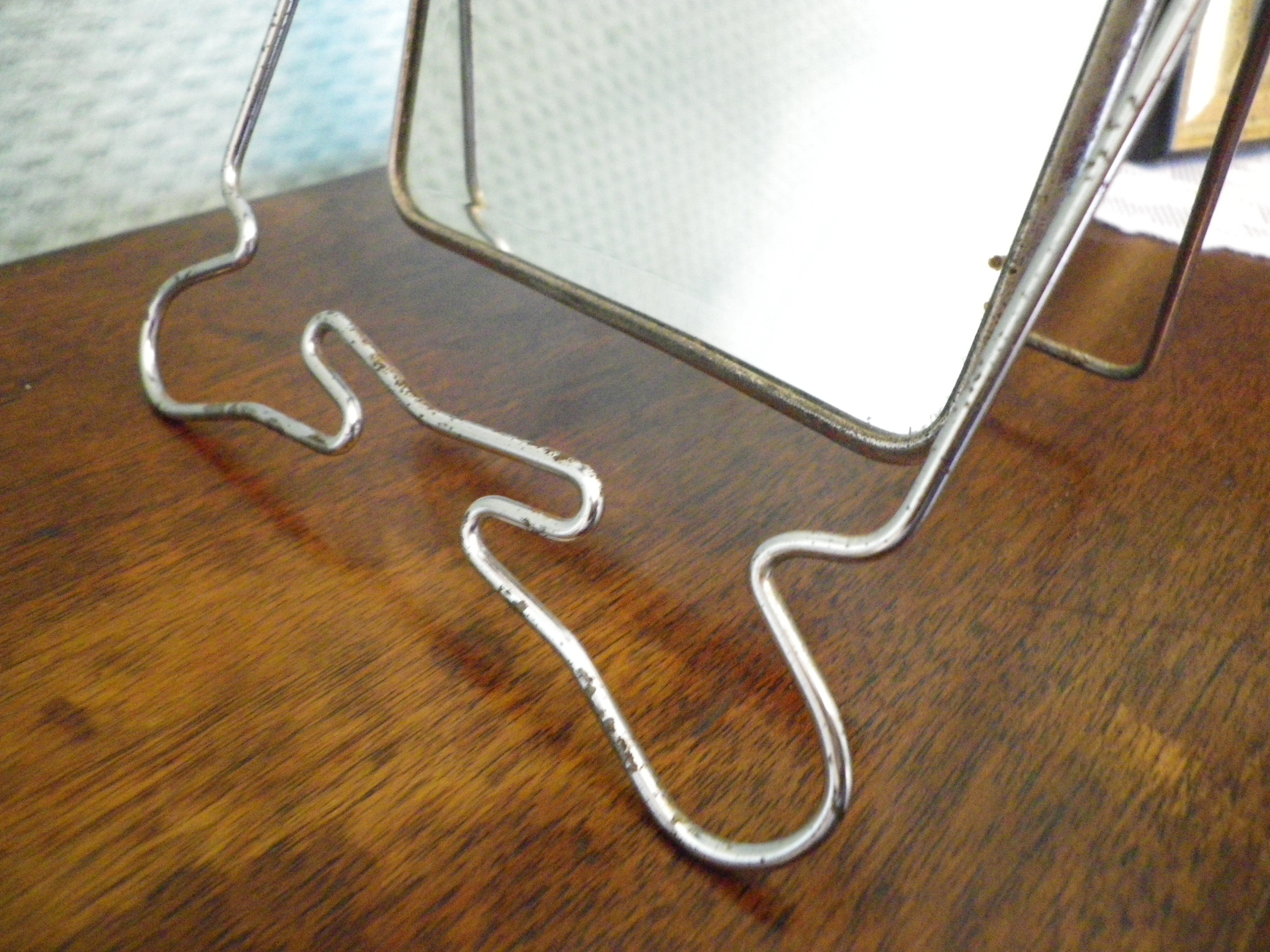 Two-foot barber mirror, suspension mode, beveled, chrome metal - 70s -