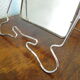 Two-foot barber mirror, suspension mode, beveled, chrome metal - 70s -