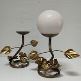 Pair of brass candle holders decorated with patinated metal flowers
