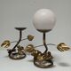 Pair of brass candle holders decorated with patinated metal flowers