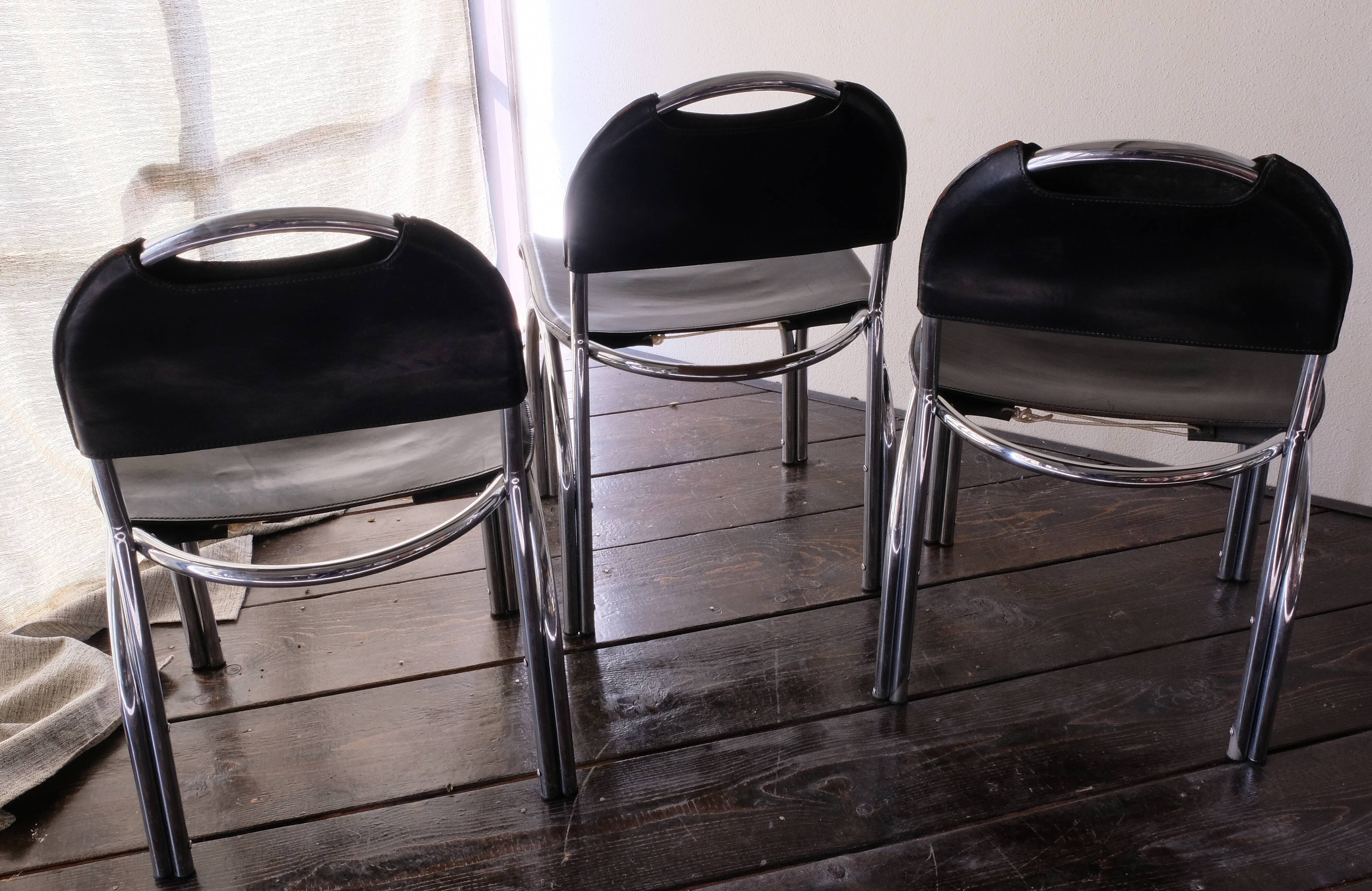 Chairs in black leather, '70