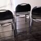 Chairs in black leather, '70