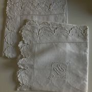 Pair of 19th-century linen pillowcases embroidered with scallops.