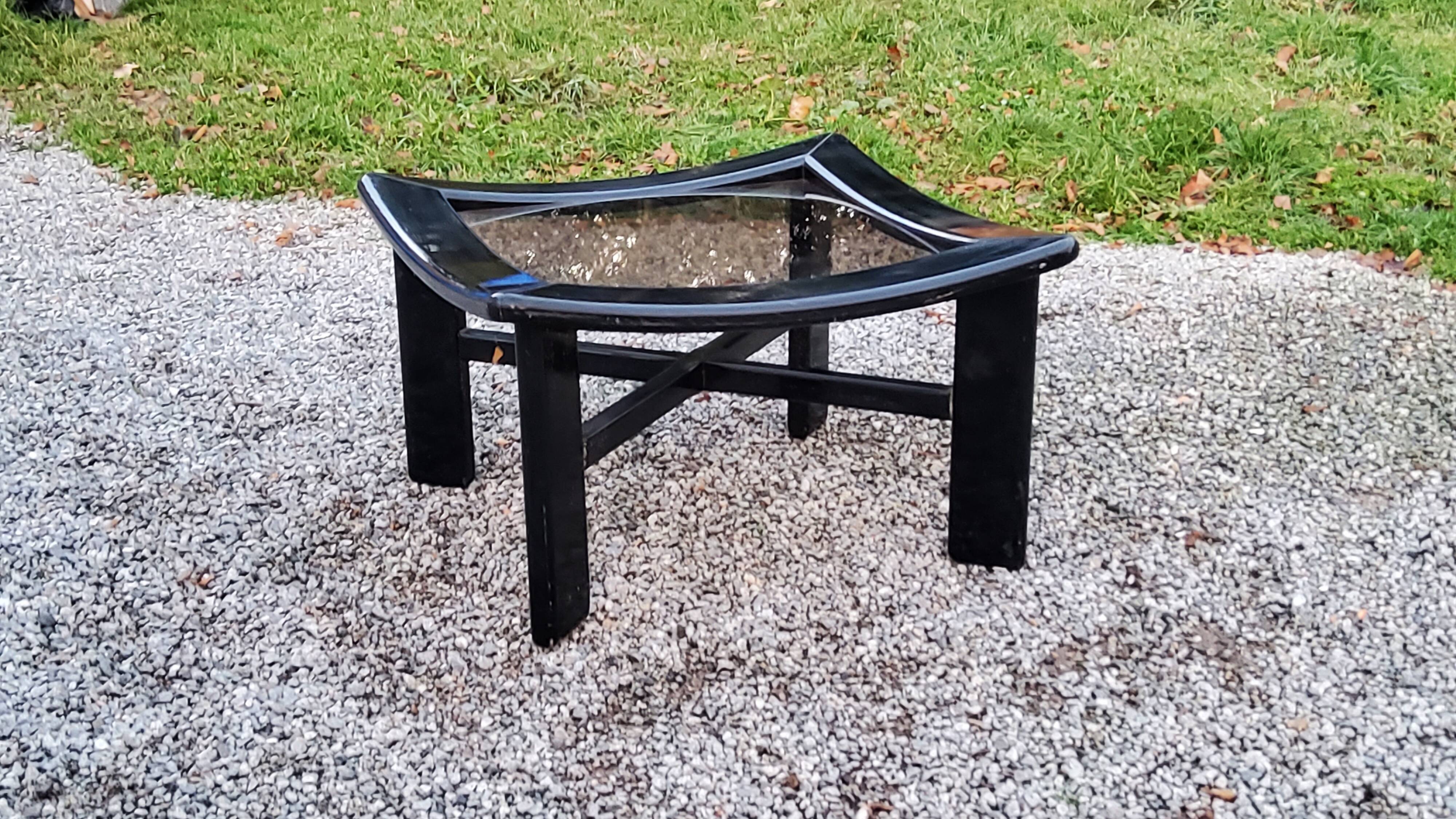 70s design coffee table in black lacquered wood with smoked glass top