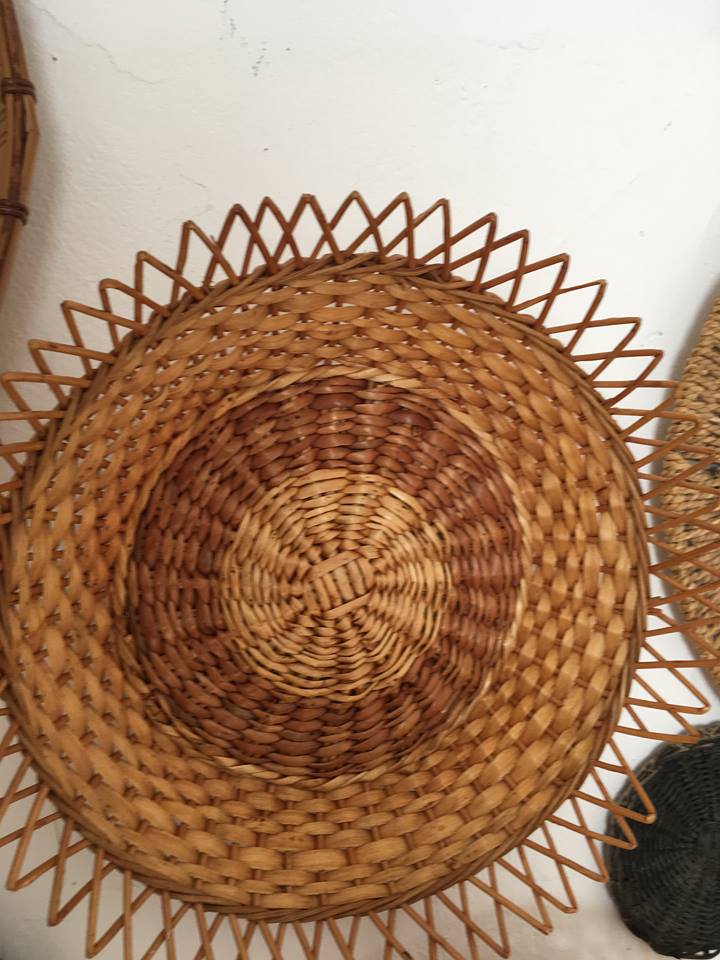 Wall composition of seven baskets and wicker trays