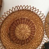 Wall composition of seven baskets and wicker trays