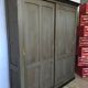 Old wooden cupboard massive sliding doors