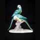 Earthenware figurine, a pair of German porcelain parrots