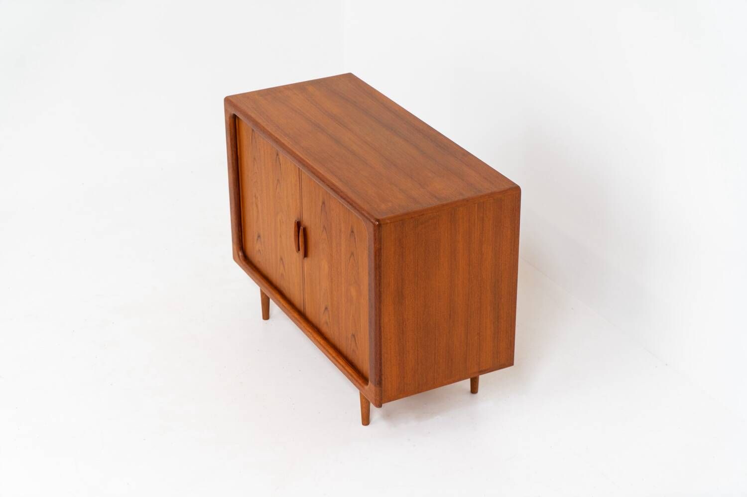 Svend Dyrlund teak sideboard with tambour doors (Denmark, 1960s).