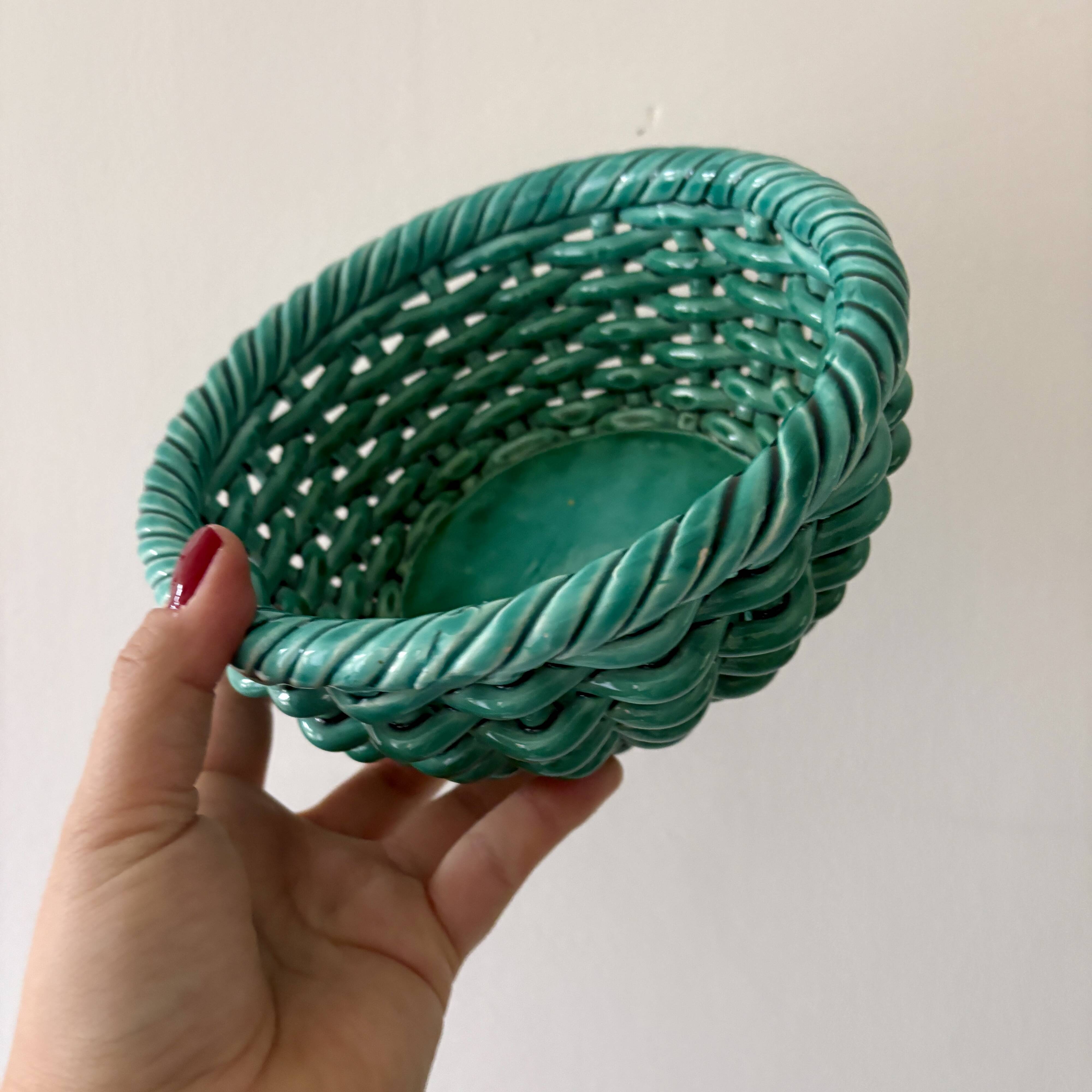 Vintage green earthenware plate/basket with fruit decorations.