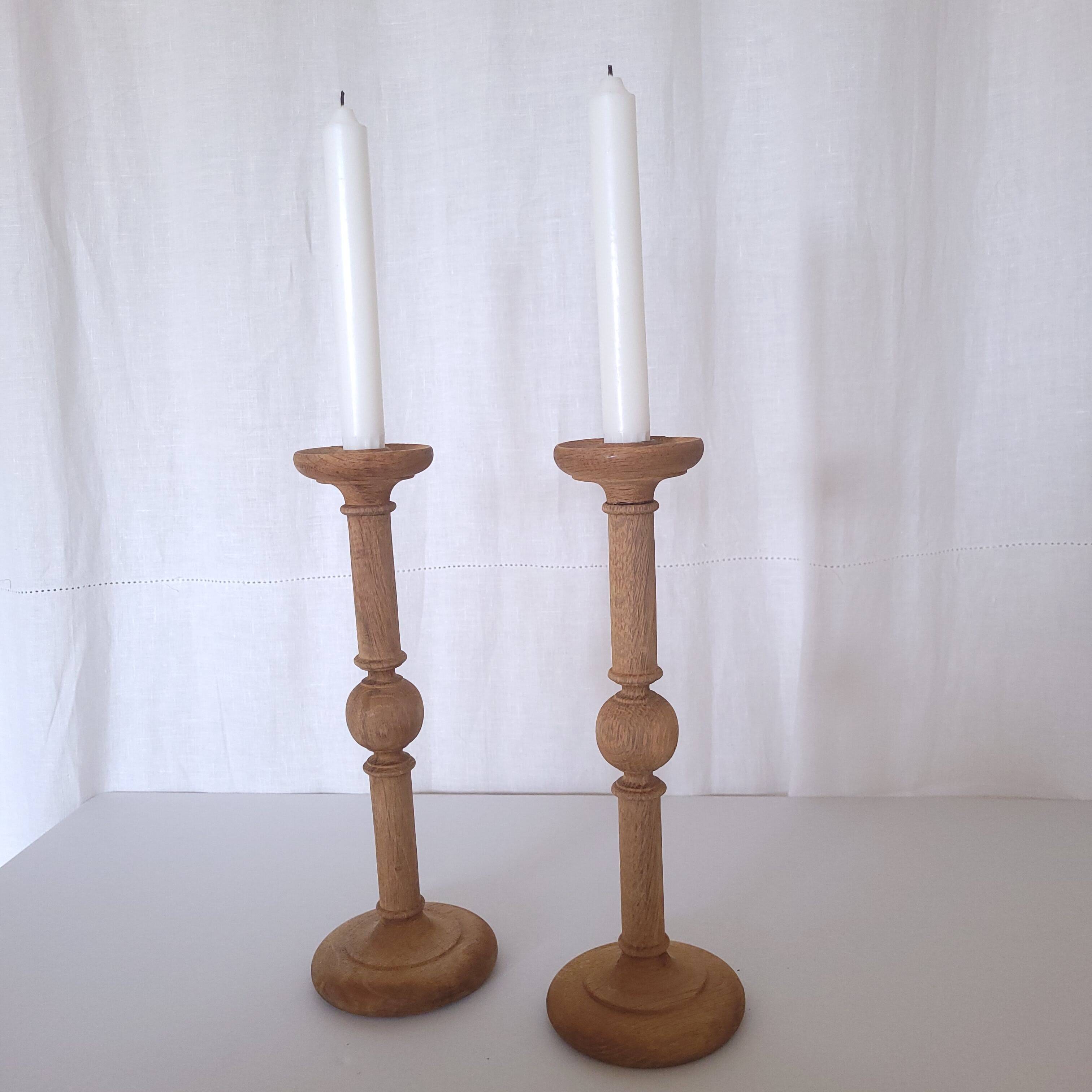 Large carved wooden candlesticks