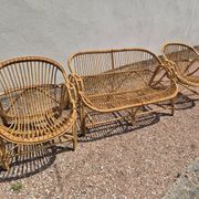 Rattan lounge with two armchairs and a vintage 1950s bench.