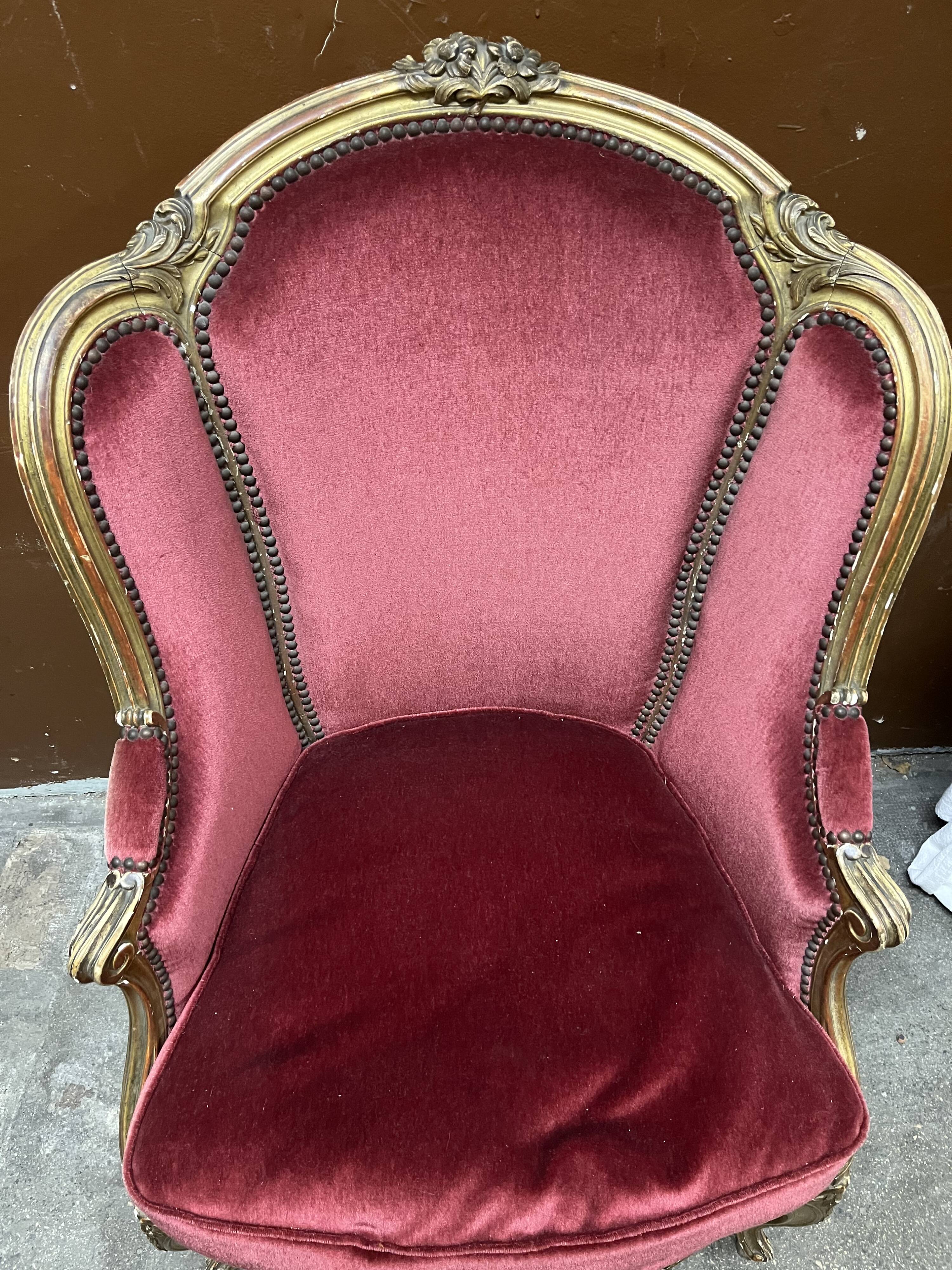 Gilded wooden armchair and footrest