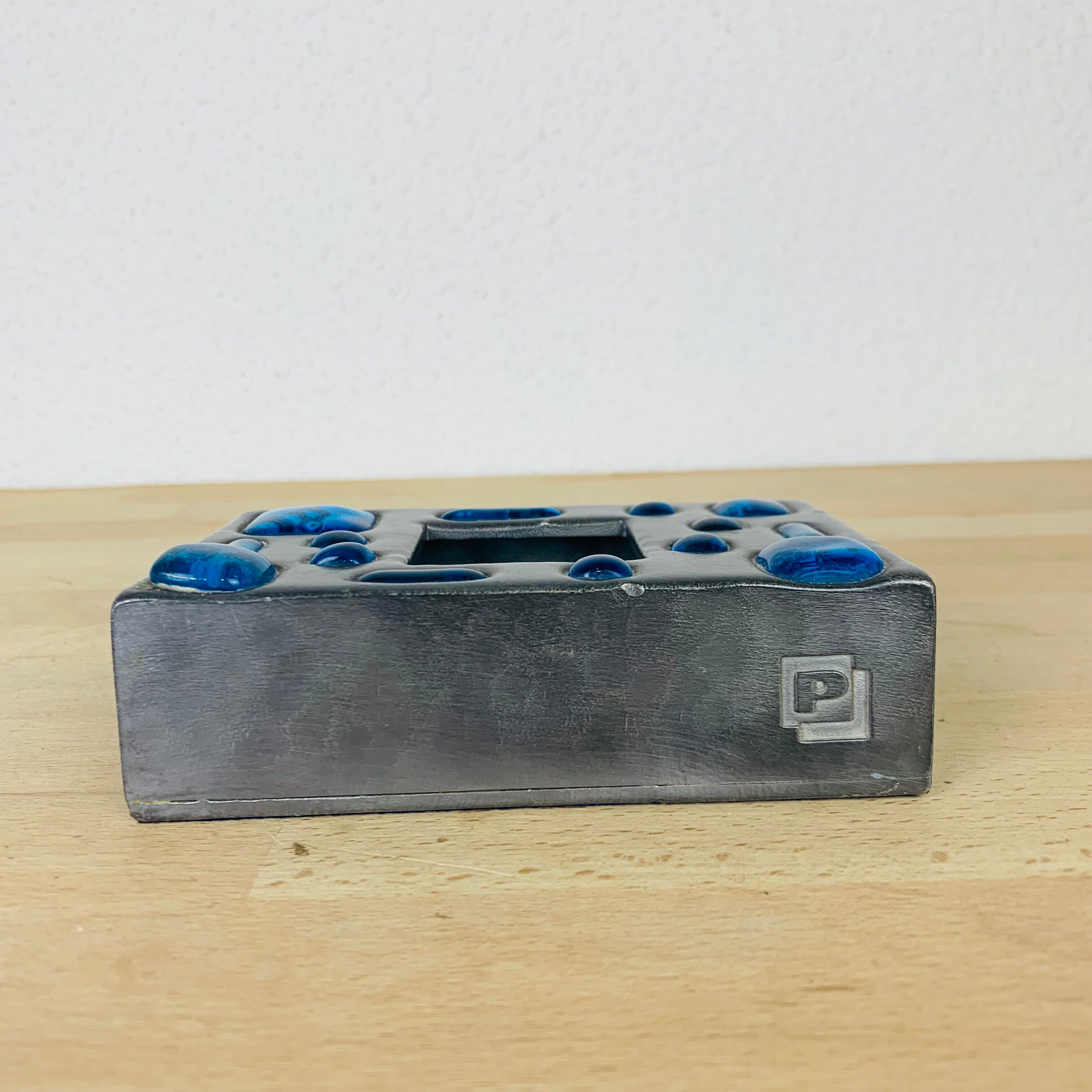 Decorative metal box and blue glass