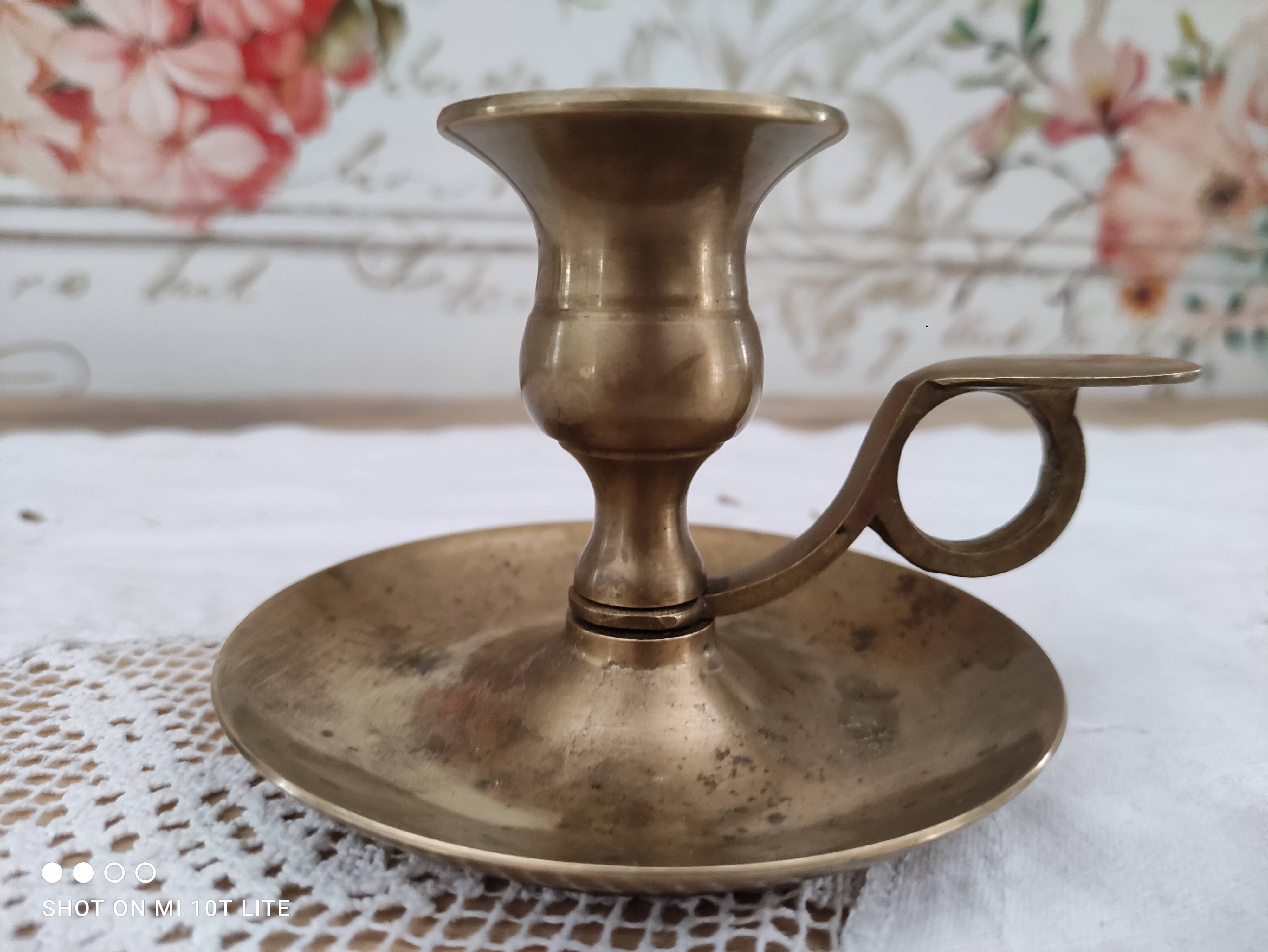 Hand candle holder called cellar rat in solid brass