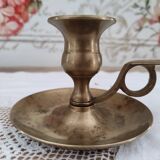 Hand candle holder called cellar rat in solid brass
