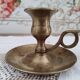 Hand candle holder called cellar rat in solid brass