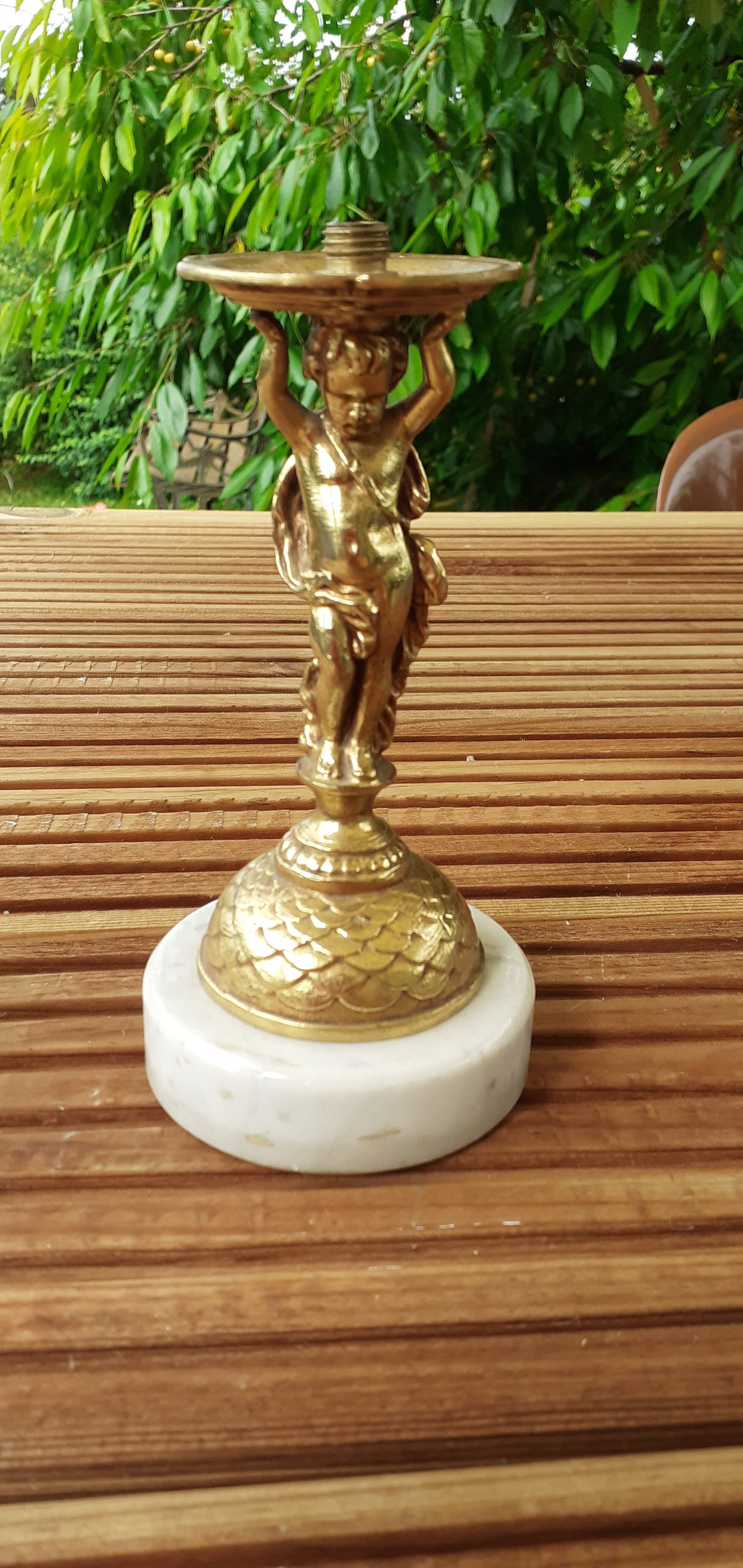 cherubic bronze lamp foot on marble base