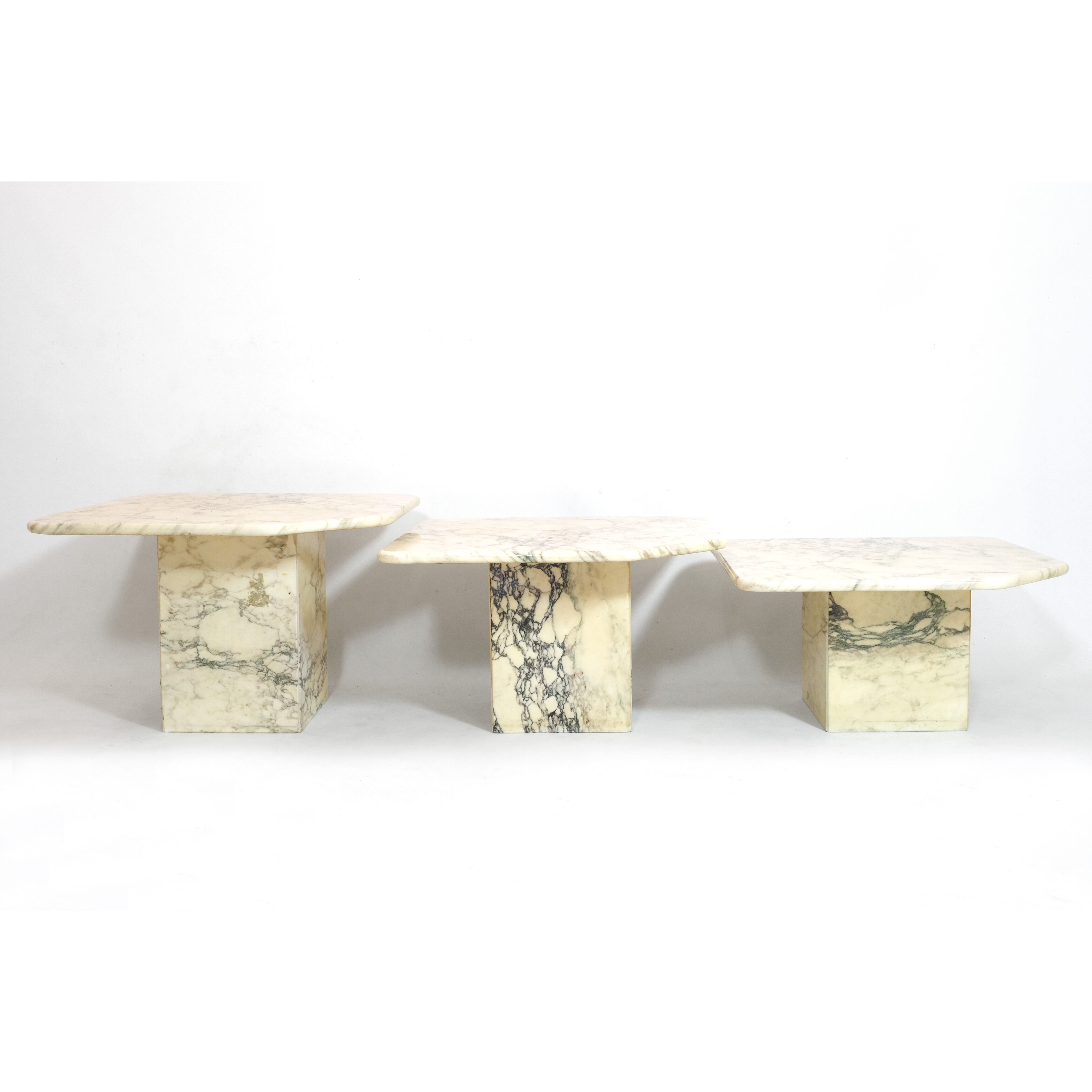 Suite of three marble trundle tables, 1970s