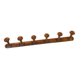 Coat rack with six wooden hooks