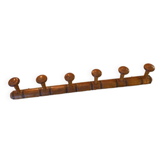 Coat rack with six wooden hooks