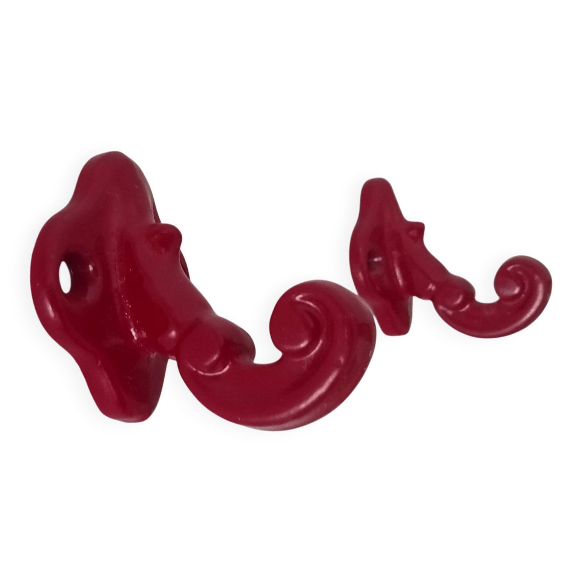 Pair of vintage wall hooks in enamelled cast iron.