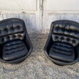 Paire de fauteuils vintage pivotants en cuir noir pied tulipe