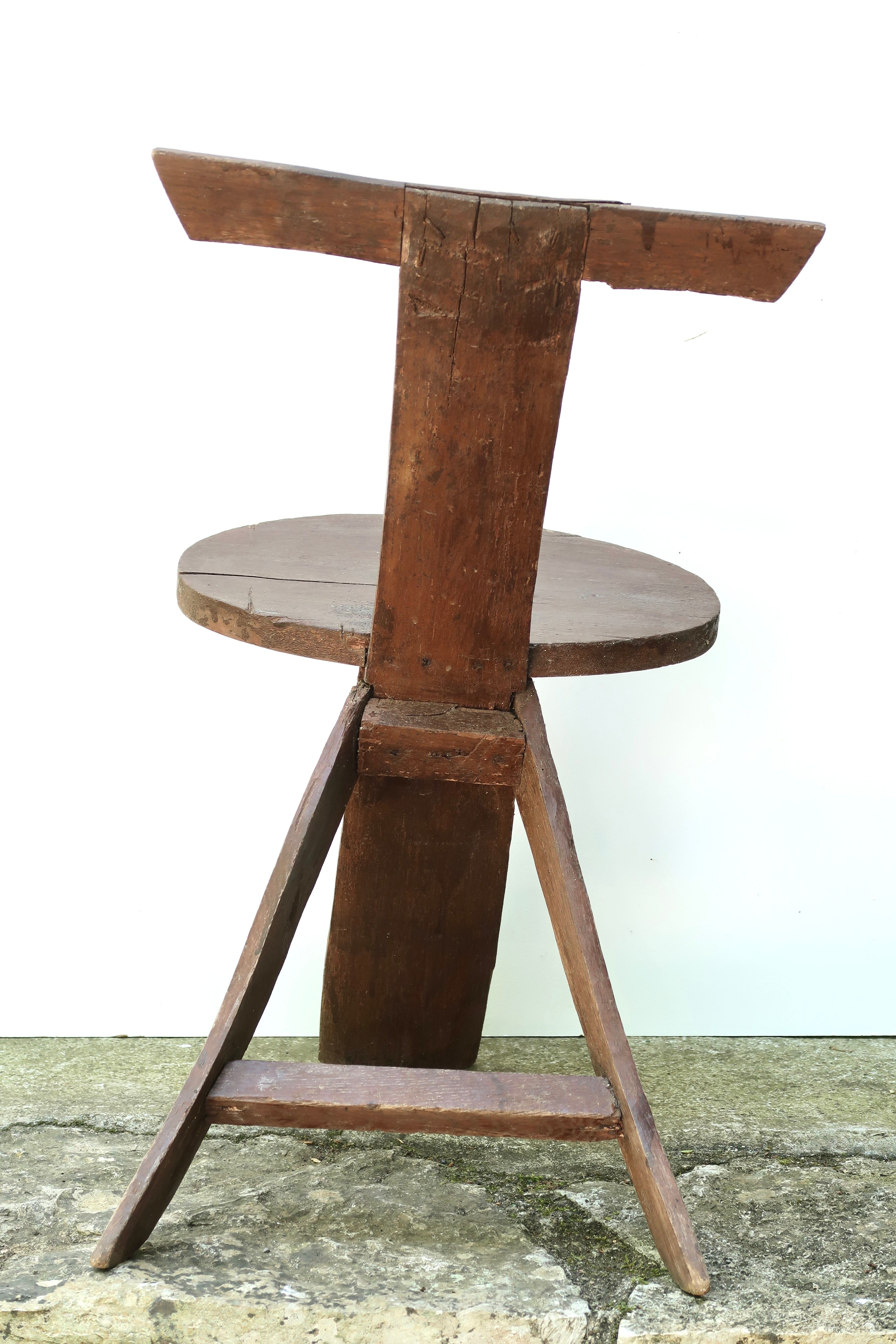 Regionalist wooden tripod chair