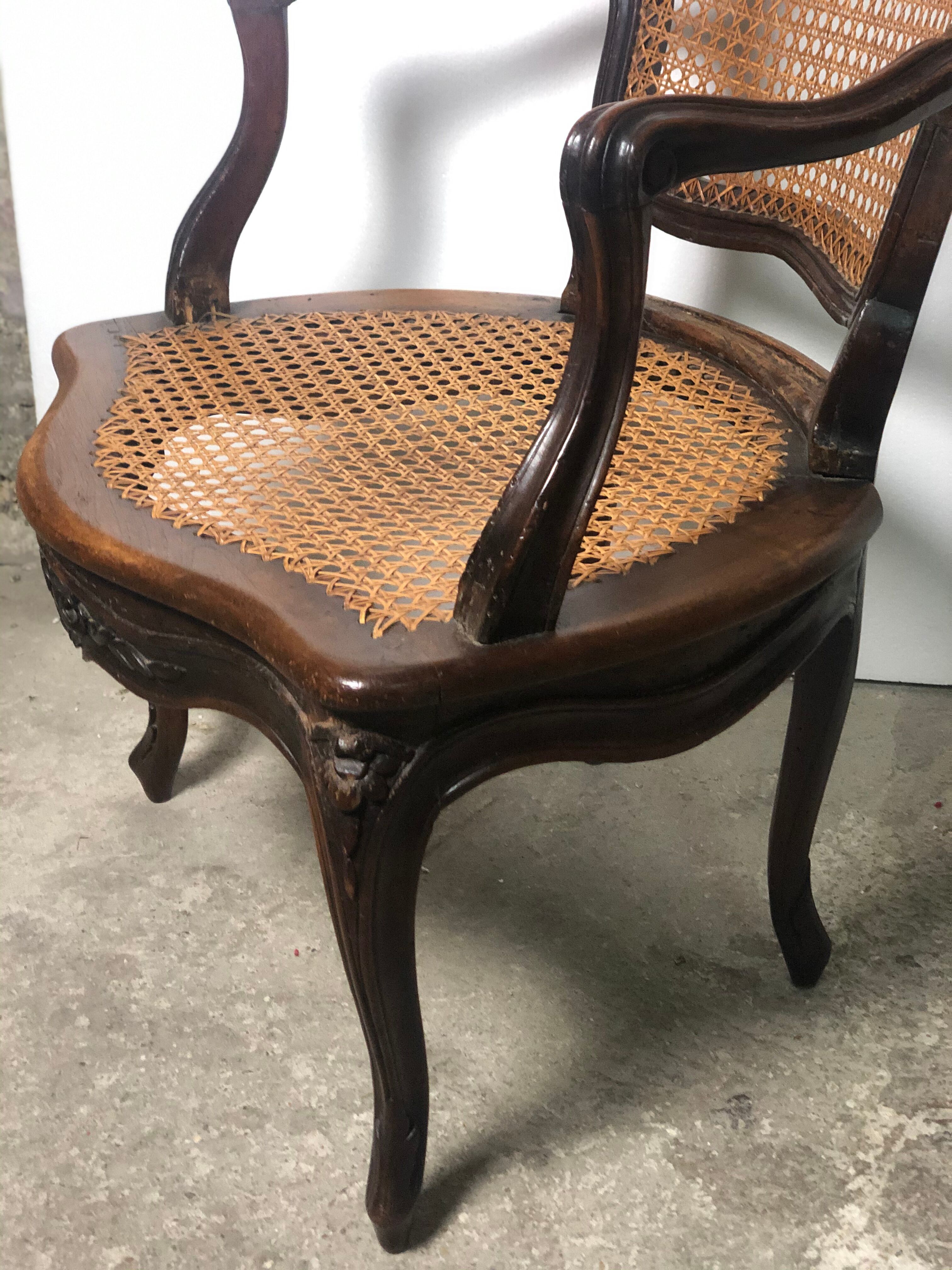 Convertible armchairs Louis XV era in walnut moulded and cannes