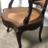 Convertible armchairs Louis XV era in walnut moulded and cannes